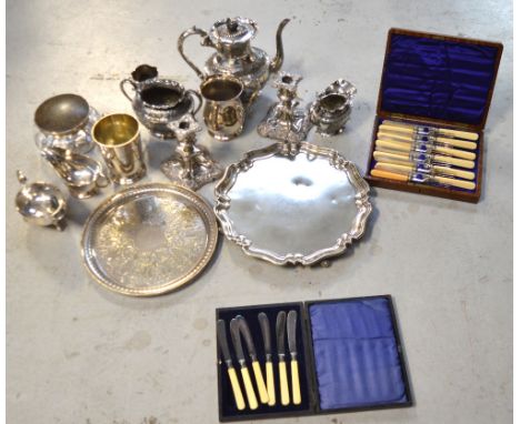 A quantity of silver plated items to include a salver with piecrust rim, a three-piece tea service, a pair of candlesticks, t