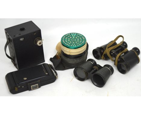 A WWII boxed gas mask, a pair of Wray 6E293 London binoculars, a pair of Lumiere cased binoculars, a box brownie and one othe