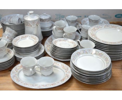 A modern floral print decorated dinner and tea service.