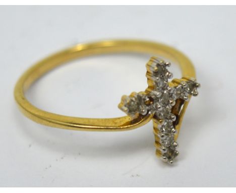 A 9ct yellow gold dress ring with stylised cross set with diamonds, size K, approx 1.3g (af).