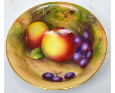 Royal Worcester; a bowl with interior painted with fruits by Edward Townsend and with mottled blue exterior, diameter 13cm, d
