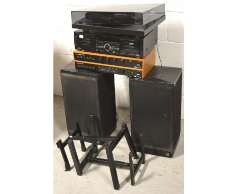 A Rega Planar 3 record deck, a pair of Kef 15763 speakers, a TEAC cassette player and a Cambridge A60 AR integrated amplifier
