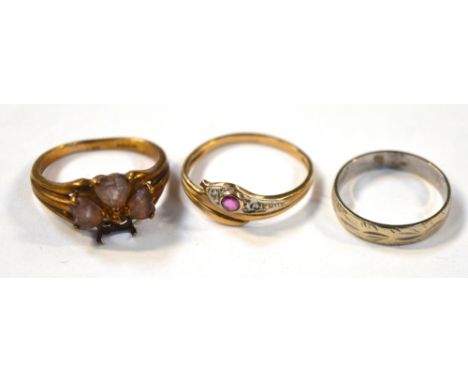 A 9ct gold dress ring set with four yellow stones, lacking one stone, size K, a ring in the form of a snake, size N and a 9ct