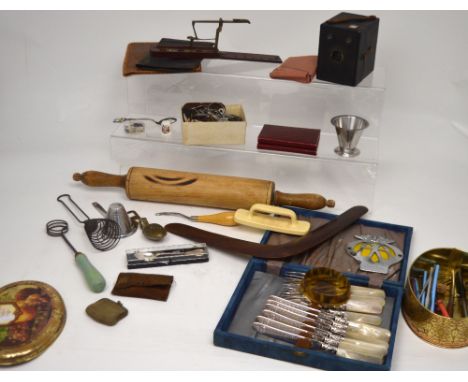 A collectors' lot to include a boomerang, a wooden rolling pin, kitchenalia, plated cased flatware, sewing aids, a Kodak Brow