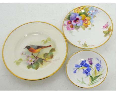 Three small pieces of Royal Worcester comprising plate painted with redstart by Powell, diameter 11.5cm and two smaller piece