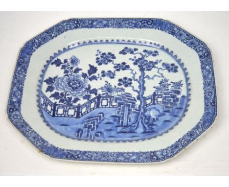 A late 18th century Chinese export blue and white meat plate of rectangular form with canted corners, floral decorated border