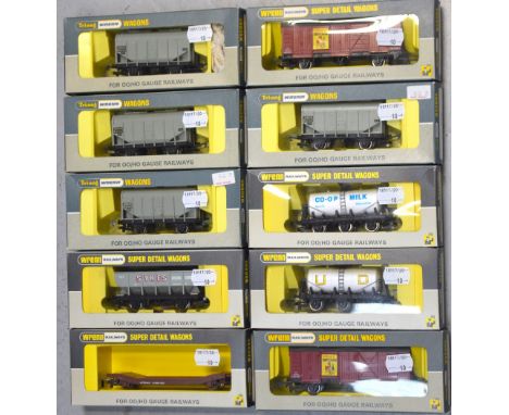 Tri-ang Wrenn H0/00 gauge rolling stock comprising two W4305P fruit vans, a W4657 milk wagon, a W5086 six-wheeled wagon, four