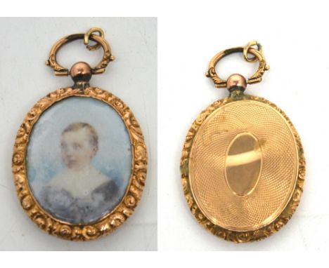 A Victorian yellow metal painted portrait pendant (af).