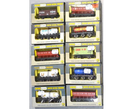 Tri-ang Wrenn H0/00 gauge rolling stock comprising three W5036 hopper wagons, a W5023 six-wheeled wagon, a W5026 mineral wago