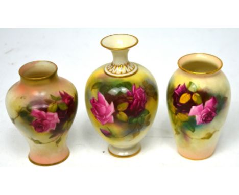 Royal Worcester; three early 20th century vases painted with roses, unsigned, heights 12.5cm and 10cm.   CONDITION REPORT  So