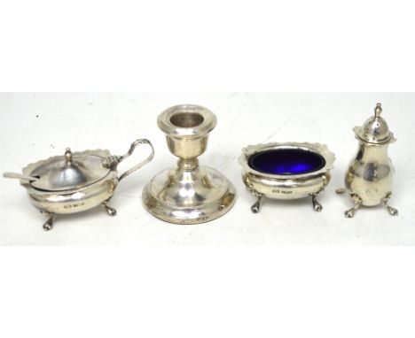 An Elizabeth II hallmarked silver cruet set to include salt, pepper pot and mustard with spoon, Birmingham 1975, approx combi