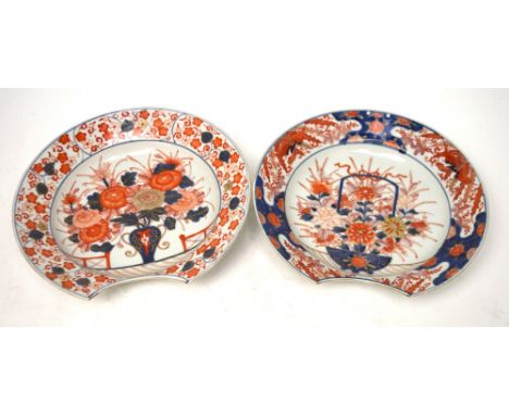 Two similar Japanese Meiji period Imari-decorated barber's bowls with concave cut section for the throat and decorated with a