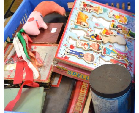 A collection of children's toys to include a painted wooden cradle, plated Humpty Dumpty money box, a spinning top, various g
