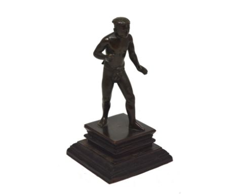 An early 20th century Japanese bronze figurine of a sumo wrestler on a wooden plinth base.