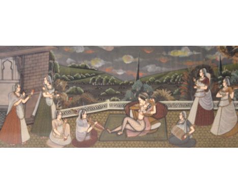 A large South Asian Mughal painting on silk depicting a Mughal prince and ladies on a garden terrace, mounted, framed and gla