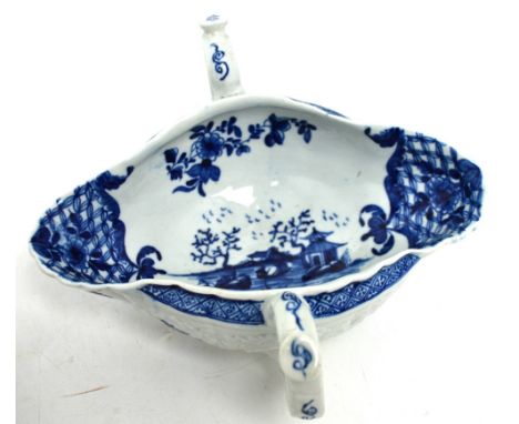 Worcester; a c1770 moulded twin-handled sauce boat with button thumb rest and decorated in blue and white with Oriental scene
