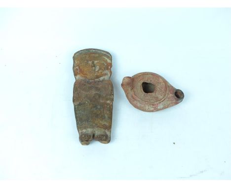 Two pre-Columbian pottery/terracotta items of a standing male figure and oil lamp.