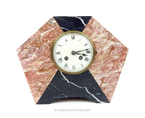 An Art Deco, 20th century, 8 day, hexagonal, pink and black marble cased mantle clock; 31.5 cm wide.