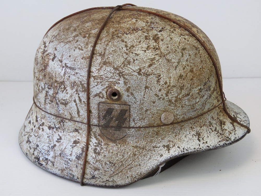 A fine reproduction WWII German SS helmet having double decal and snow