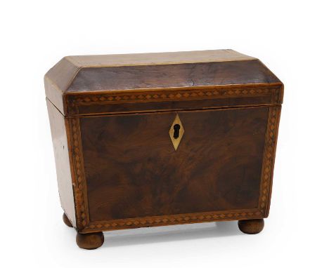 A George III inlaid yew wood tea caddy,  of sarcophagus form with chequer banding and ivory escutcheon, the interior with mat