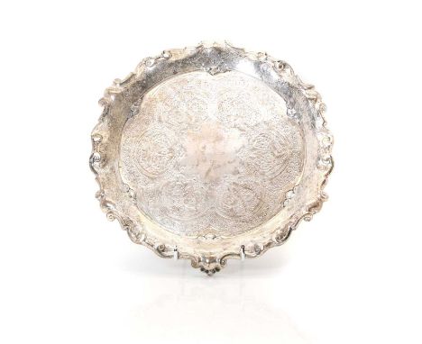 A Victorian Scottish silver salver, by Hamilton &amp; Inches, Edinburgh 1896, with chased decoration raised on three scrolled