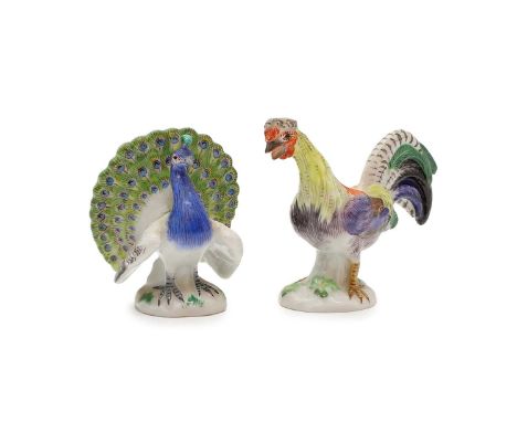 A Meissen miniature model of a peacock, incised to base 77170, with blue crossed swords,5.5cm high,together with a similar of