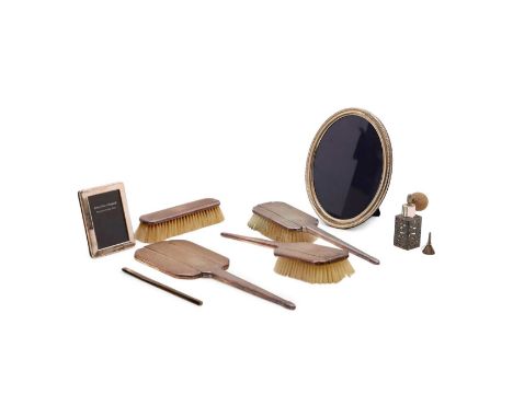 A collection of silver items, to include, a silver mounted dressing table set, comprising two hairbrushes, 26cm long, a cloth