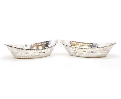 A pair of silver bread baskets, by Goldsmiths &amp; Silversmiths Co Ltd, Chester 1913, of navette form with a pierced border,