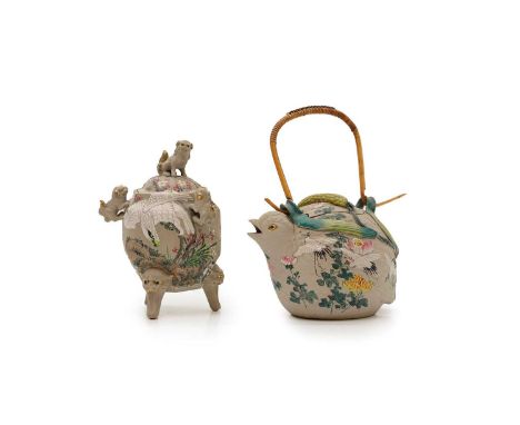 A Japanese Banko stoneware quail teapot and cover, c.1920, the dumpy bird enamelled with cranes and flowers, reeds forming lo