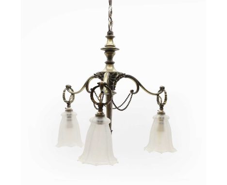 A silvered brass three branch ceiling light, with a torch shaped sentral section, with scrolled arms, fitted with frosted gla