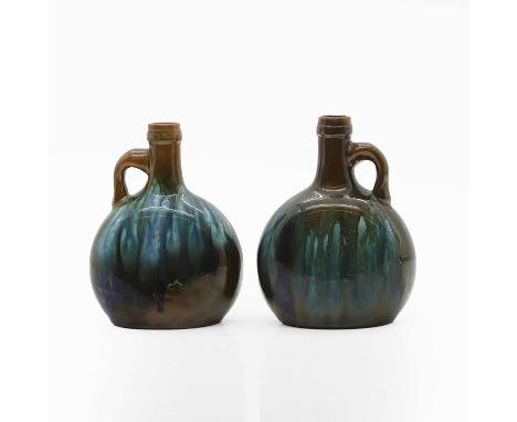 A pair of Linthorpe Pottery bottle vases,  designed by Dr Christopher Dresser, each with trailing glazes, impressed marks and