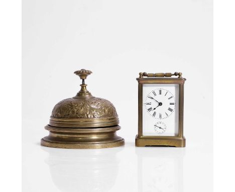 A brass carriage timepiece, with an enamel dial,14cm high, anda Victorian-style brass counter bell,13cm diameter (2)Condition