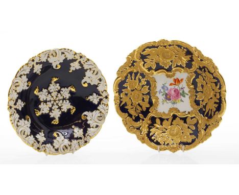 A Meissen dish  20th century, the floral spray centre within a cobalt blue and gilt foliate decorated border, 28.5cm diameter