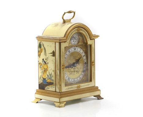 An Elliott japanned mantle clock,  retailed by Harrods, with an arched dial, 18cm high  Condition ReportSome chips to the edg