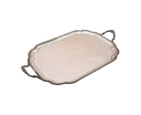 A silver two-handled tray, London 1928, of shaped rectangular form, engraved 'MS 3-8-28 CM 9-3-57',69cm wide, approx 123oztCo