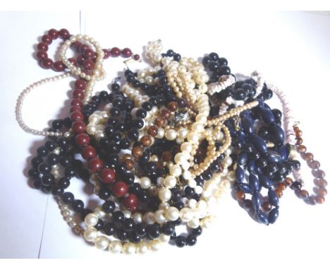 Box of hand knotted ceramic and stone bead necklaces
