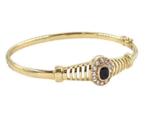 9ct gold sapphire and cubic zirconia hinged bangle, stamped 375Condition Report: Approx 8.65gm, inner circumference = 18cm, g