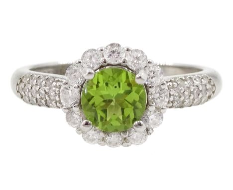 Silver peridot and cubic zirconia flower cluster ring, stamped 925Condition Report:Size R, good condition 