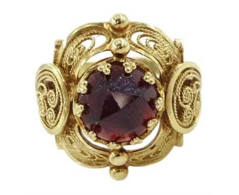 14ct gold single stone garnet filigree design ringCondition Report:Approx 5gm, tested 14ct, size P-Q, head diameter = 28mm, v