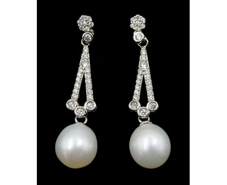 Pair of silver pearl and cubic zirconia openwork pendant stud earrings, stamped 925 Condition Report:Length = 33mm, good cond