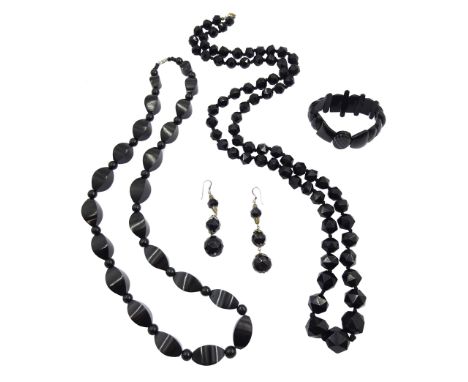 Victorian and later jet jewellery including two necklaces and pair of pendant earrings, jet and agate bracelet, graduating cu