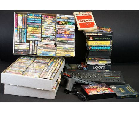 Retro Gaming - A Sinclair 128K ZX Spectrum +2 computer with power supply and gun accessory, together with a large collection 