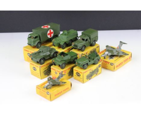 Eight Boxed Dinky military diecast models to include 626 Military Ambulance, 641 Army 1-Ton Cargo Truck, 676 Armoured Personn