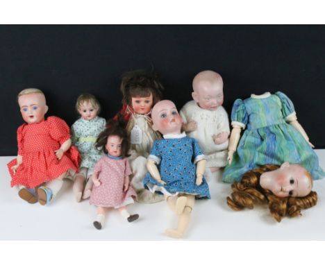 Seven German porcelain bisque dolls to include Kammer Reinhardt 126 and another baby dolls with the same mark, Schoenau &amp;