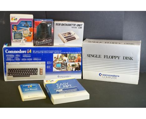 Retro Gaming - A boxed Commodore 64 MicroComputer with power supply &amp; user manual, together with a Commodore 64 Communica