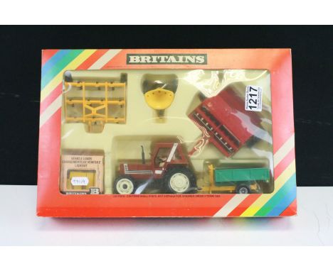 Boxed Britains 9591 Fiat Tractor and Implement Set appearing to be complete, models ex, box vg with some discolouring 