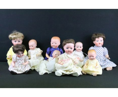 Group of nine German bisque baby dolls all having hand painted features to the faces and composite bodies with articulated li