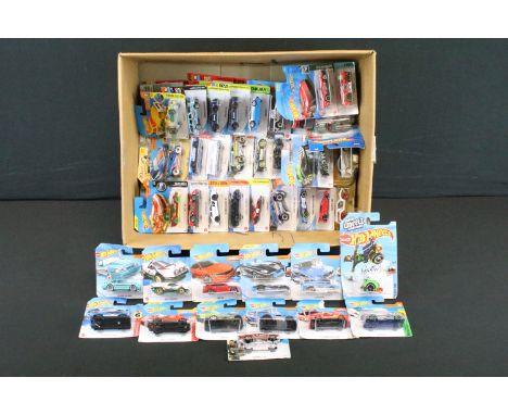 Over 80 carded Mattel Hot Wheels diecast models, featuring Retro Racers, HW Daredevils, Muscle Mania, Tooned, HW Drift, etc. 
