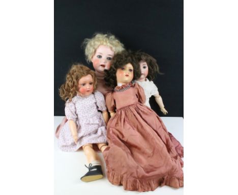 Four German bisque dolls all having hand painted details tot the heads, open mouths with teeth and sleeping eyes. To include 