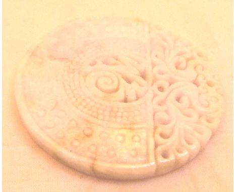 20thC intricately carved Chinese pale green and lavender jade disc amulet, D: 5 cm